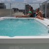 Hydropool Swim Spa AquaSport 14 Ft Roof Top Women Sunbathing