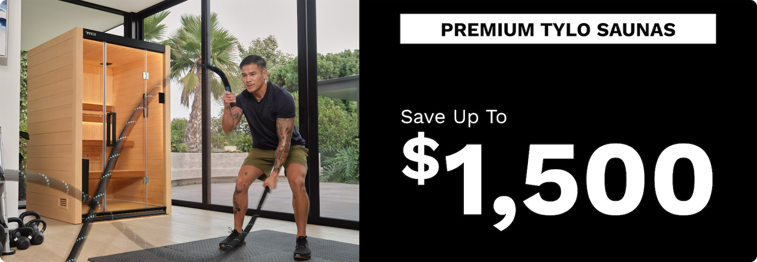 Man in a home gym using battle ropes beside a wooden glass-front sauna; right side shows 'Premium Tylo Saunas' and 'Save Up To $1,500'
